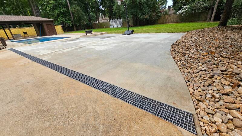 concrete, patio driveway with channel drains installed in tomball tx