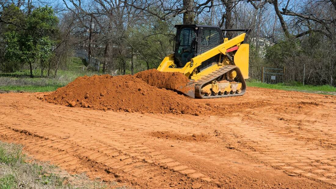 topsoil leveling with a machine in houston tx