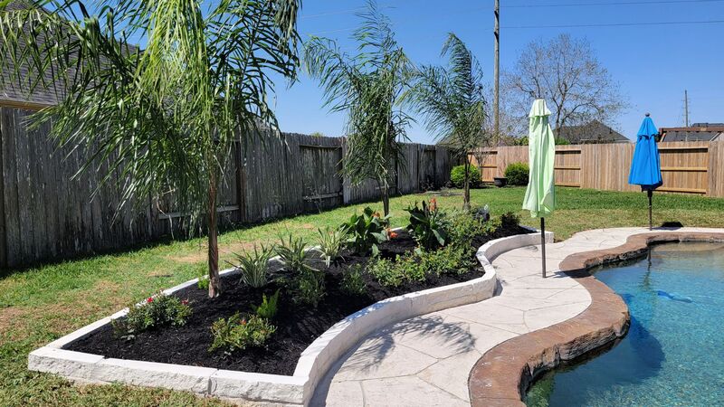 garden retaining wall installed around pool in richmond tx